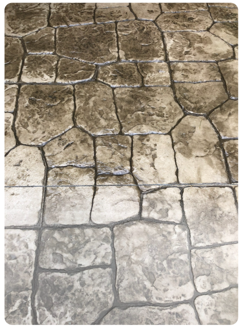 Stamped concrete surface after professional cleaning and sealing, highlighting restored color, texture, and joint protection.