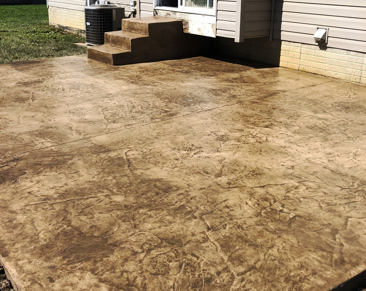 patio constructed of stampled concrete off back stoop